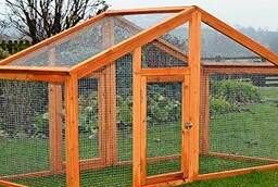 Cages with a house for rabbits.