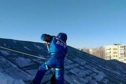 Сброс снега с крыш в Томска