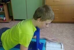 Scoliosis reading stand  lying lessons