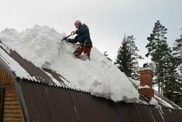 Removing snow from roofs  Cleaning roofs from snow