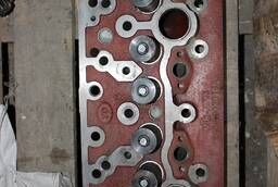 MTZ tractor cylinder head assembly with valves .