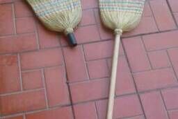 Sorghum brooms and a broom on handle